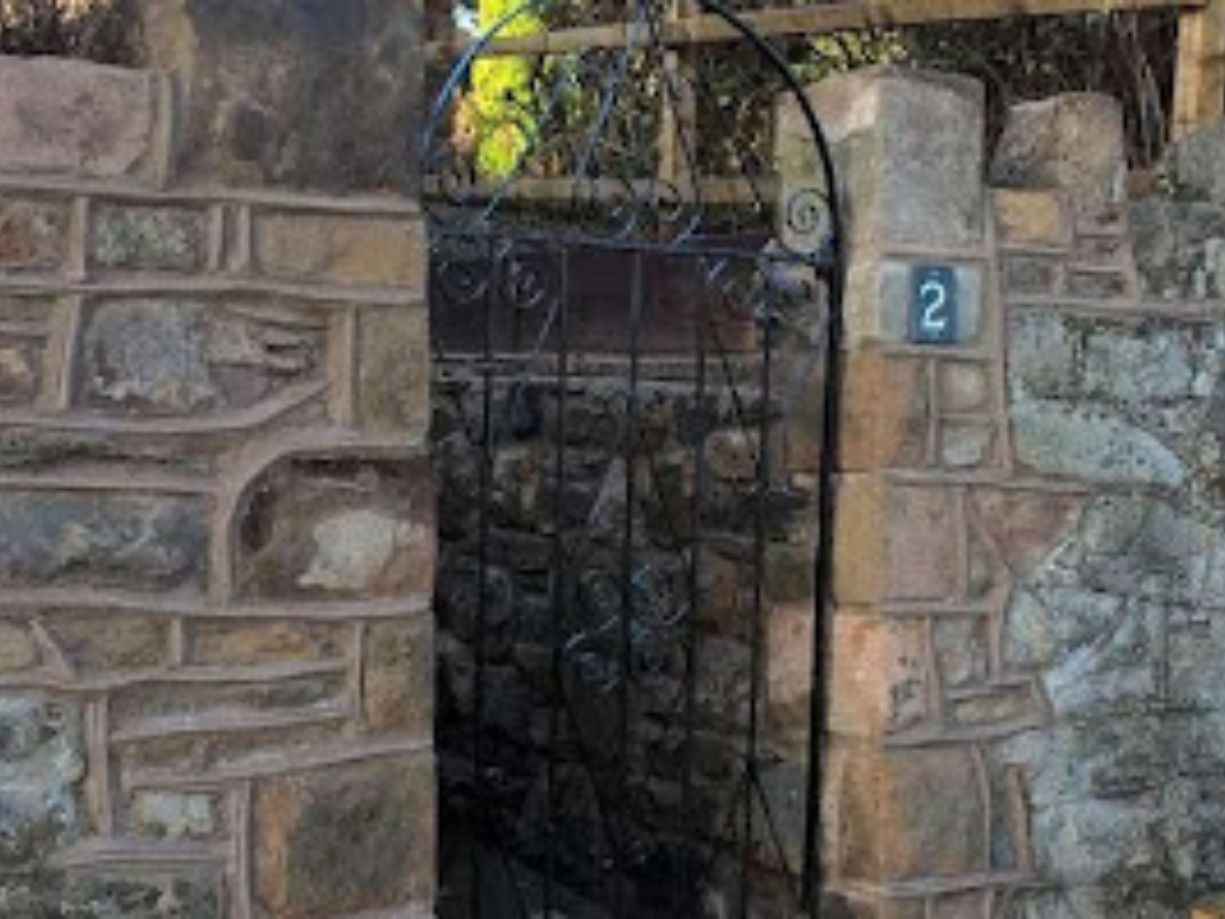 stone entrance design with repoininting completed